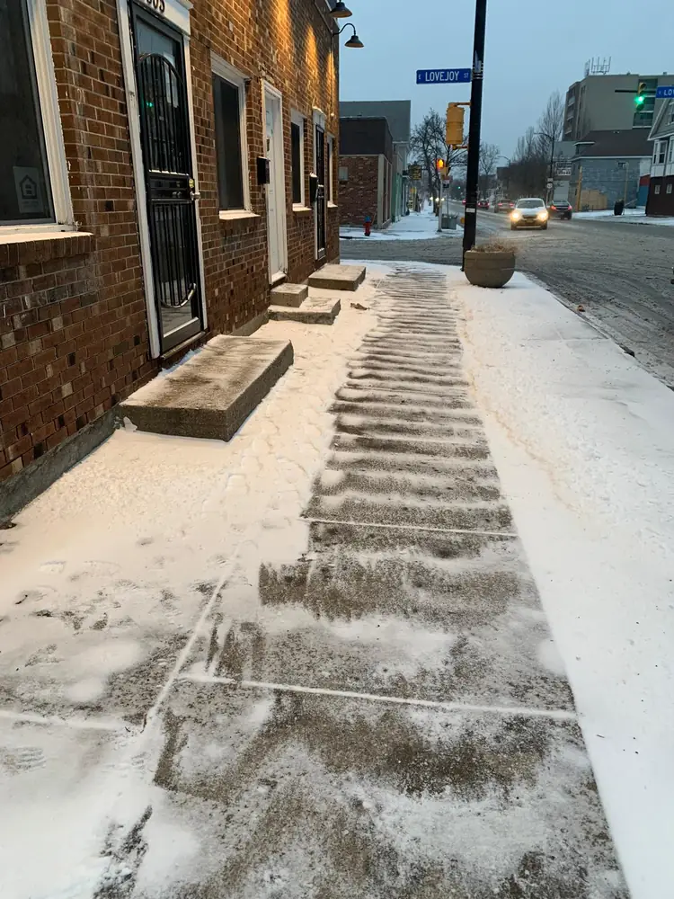 Commercial sidewalk and entry steps cleared and salted in Buffalo NY