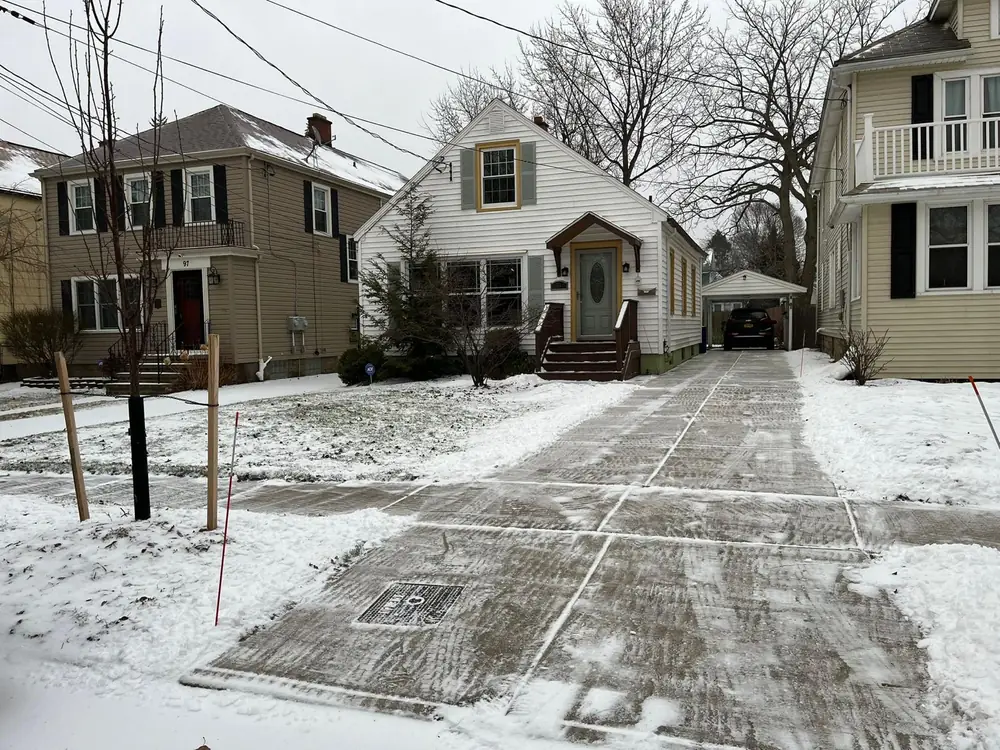 Driveways cleared down to the pavement after a Buffalo NY snowfall
