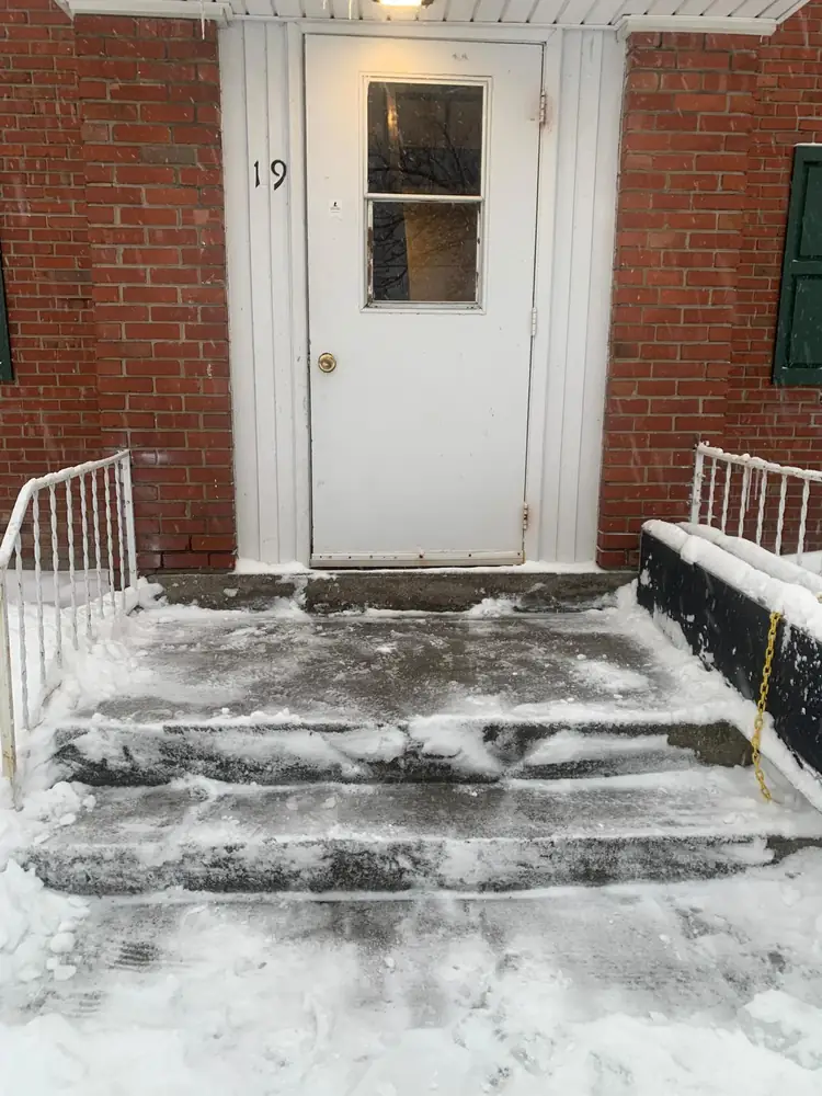 Front entry steps shovelled and salted at a Buffalo NY home
