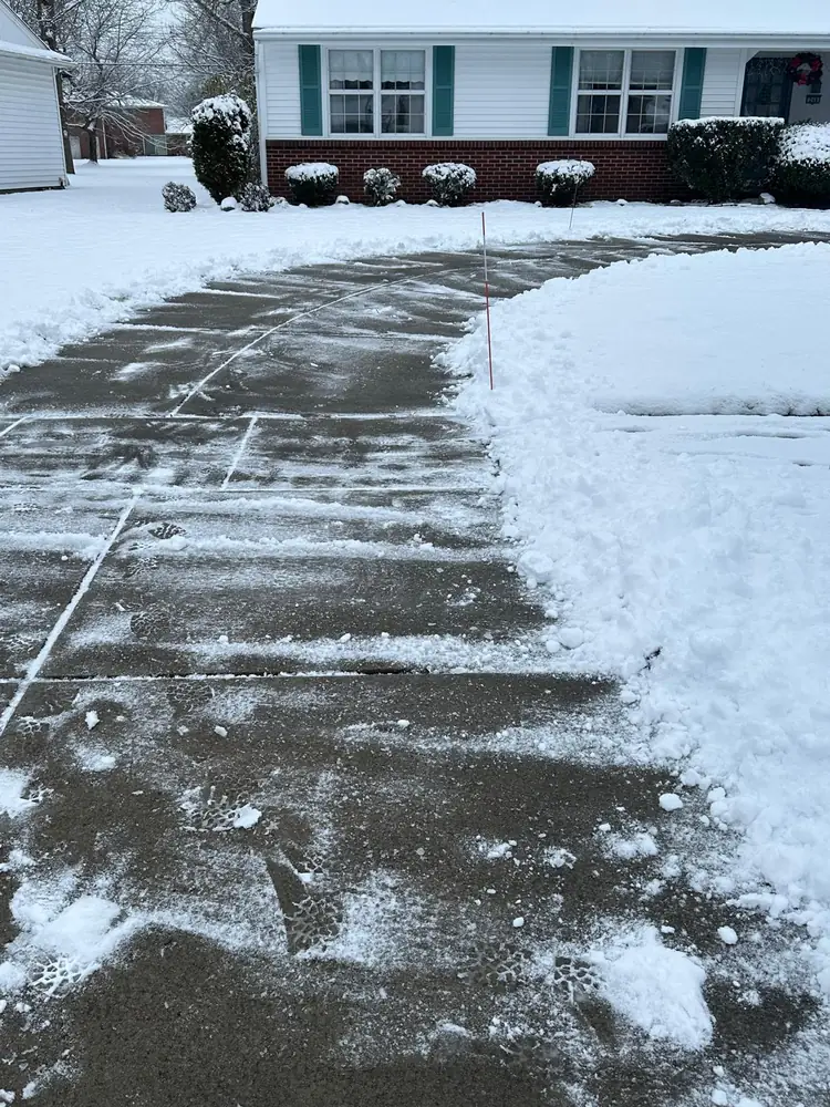 Residential driveway and walk cleared after an overnight snowfall in Buffalo NY