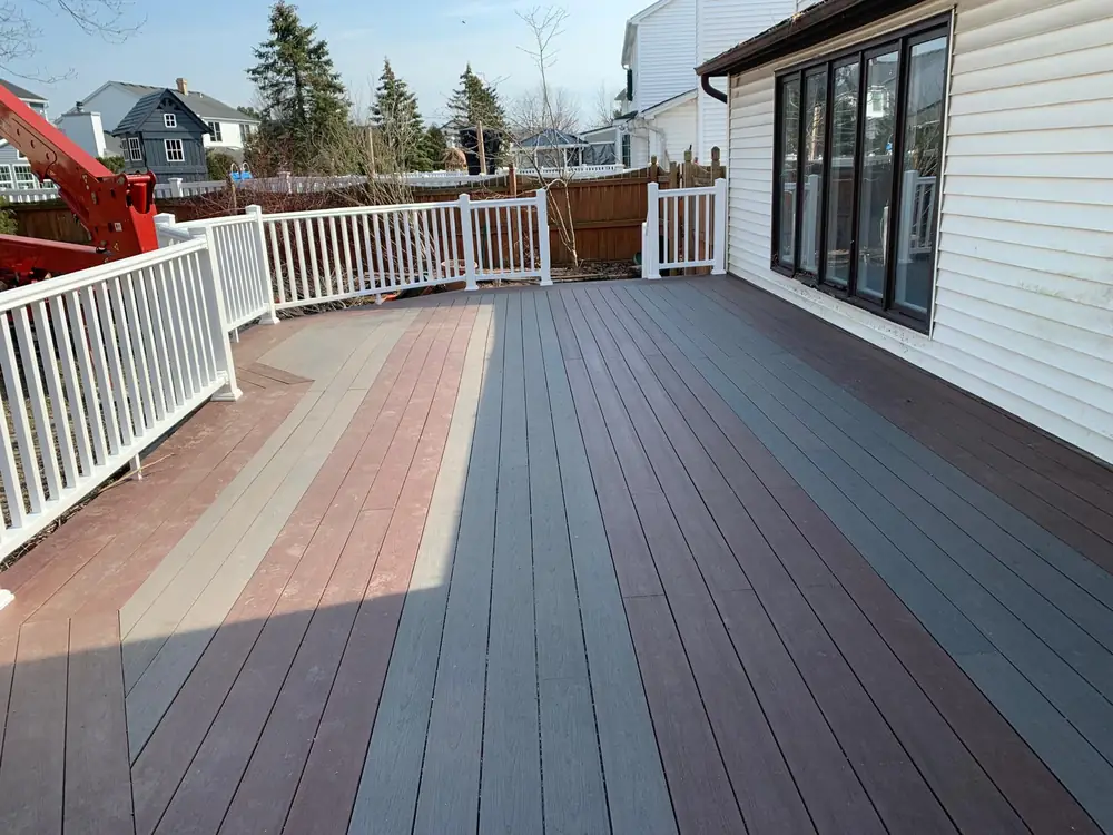 Two tone composite deck with white railing in Buffalo NY