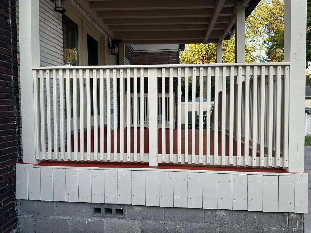 White porch railing and skirting rebuilt on a Buffalo NY home