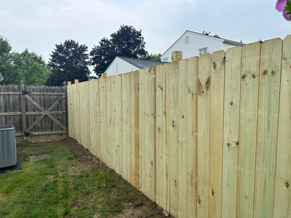 Wood privacy fence installed around a back yard in Buffalo NY